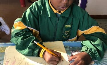 Lion Sanctuary Teaching School - kid writing